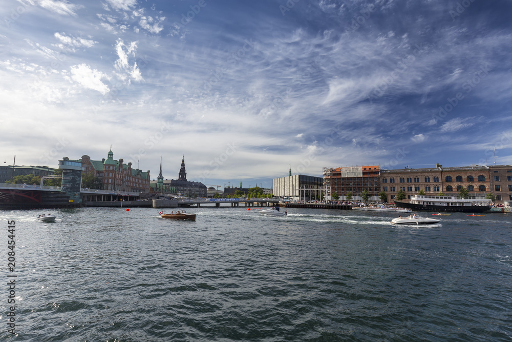 Wide angle view of summer activities on a canal in Copenhagen, Denmark.