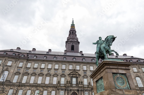 Storm clouds over the Christiansborg Palace and Frederik VII statue.