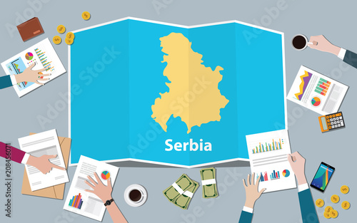 serbia economy country growth nation team discuss with fold maps view from top