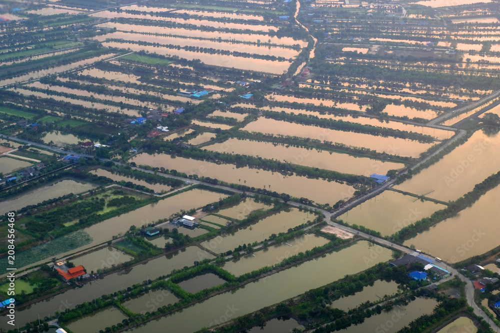 top view field roads and city, aerial photo from plane ,Thailand