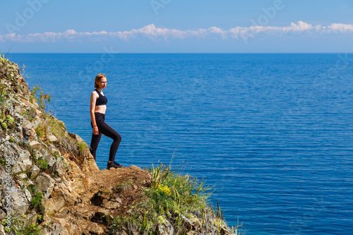 A girl in black clothes at Baikal lake