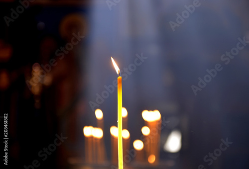 bruning candle in an orthodox church photo