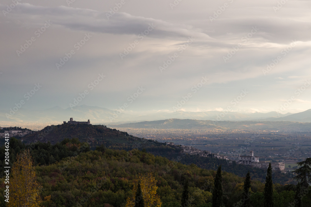 Fototapeta premium View of Assisi town from behind, with Francis church and Fortres