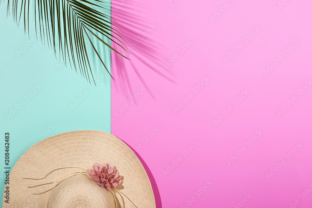 Colorful summer female fashion outfit flat-lay. Pink blue background, palm branches. Punchy Pastels. New Minimalism