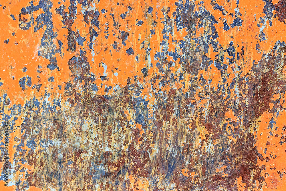 Metallic orange background with peeling paint and spots rust, texture.