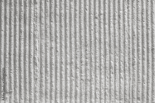 Obraz na płótnie White wall with decorative plaster and vertical stripes. texture, background.