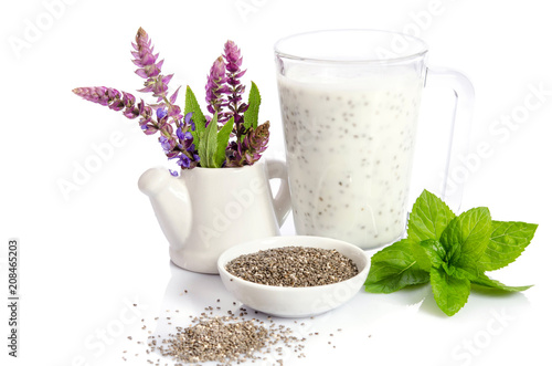 healthy breakfast   yogurt with chea seeds  mint leaves and  salvia flowers isolated on white