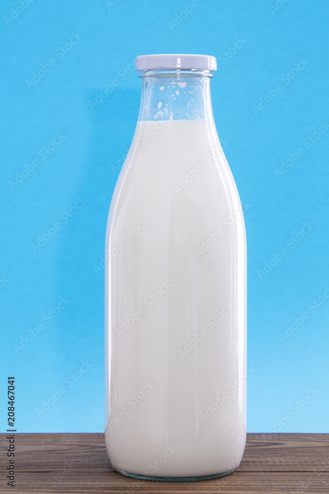 milk bottle on wooden table milk bottle on wooden table