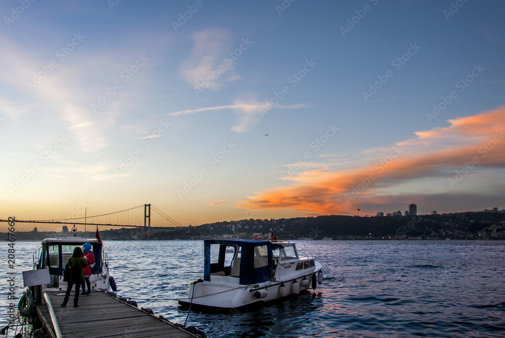 Istanbul, Turkey, 15 December 2017: Bosphorus Bridge and boats at evening on cengelkoy