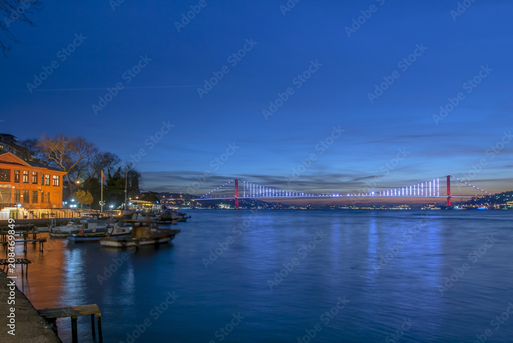 Istanbul, Turkey, 26 December 2017: Bosphorus Bridge and boats at shores of Bosphorus