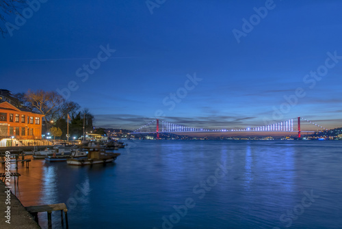 Istanbul, Turkey, 26 December 2017: Bosphorus Bridge and boats at shores of Bosphorus © Kayihan