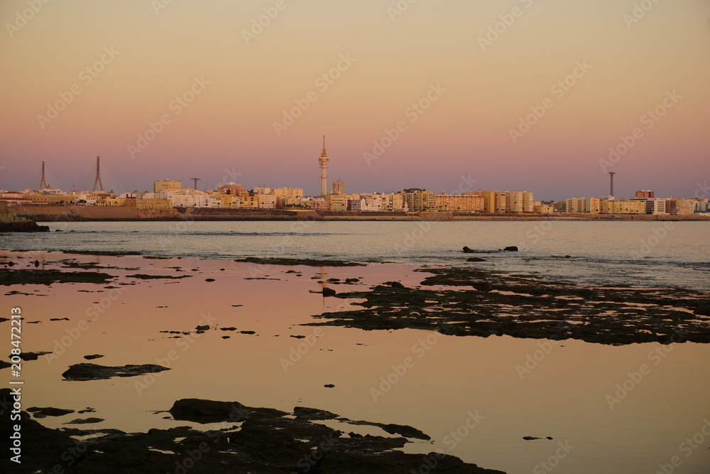 Beautiful view of the waterfront of the city of Cadiz and the ocean at sunset, horizontal image, Cadiz, Andalusia, Spain Beautiful view of the waterfront of the city of Cadiz and the ocean at sunset, horizontal image, Cadiz, Andalusia, Spain