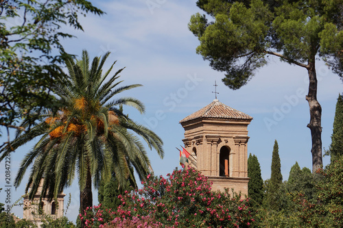 A beautiful view of the flowering gardens of the fortress complex Alhambra, Granada,  Andalusia, Spain