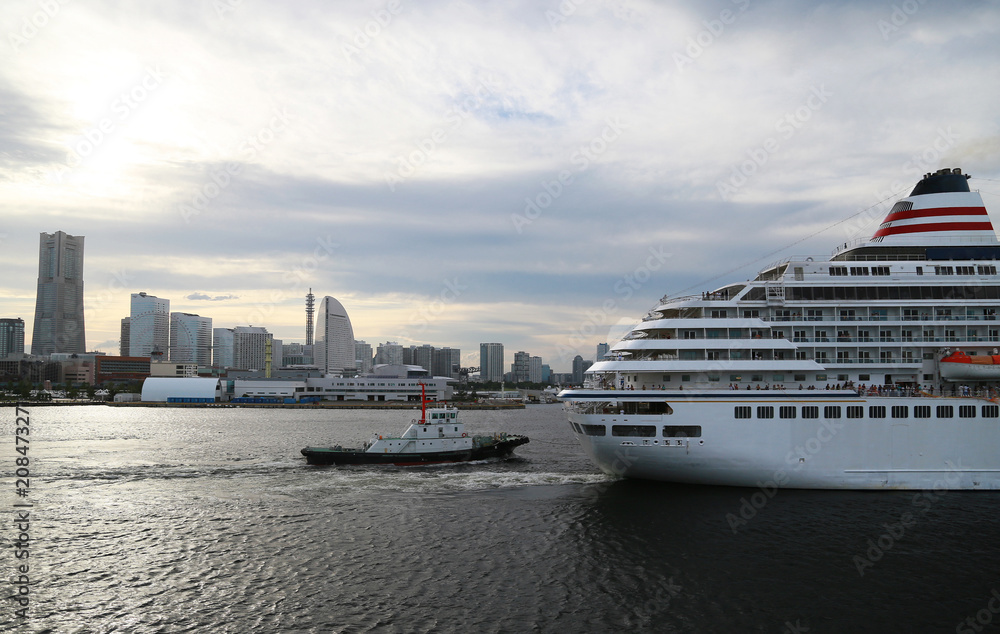 Passenger ship and the tugboat which navigate Japanese Yokohama Port Passenger ship and the tugboat which navigate Japanese Yokohama Port