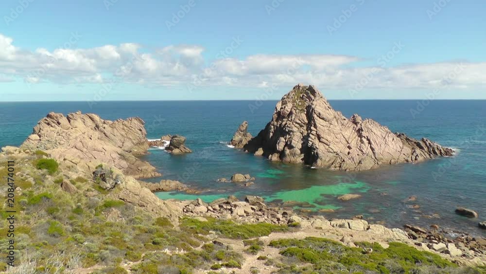 Sugarloaf Rock, a famous coastal landmark near the town of Dunsborough in South-West Australia. Sugarloaf Rock, a famous coastal landmark near the town of Dunsborough in South-West Australia.