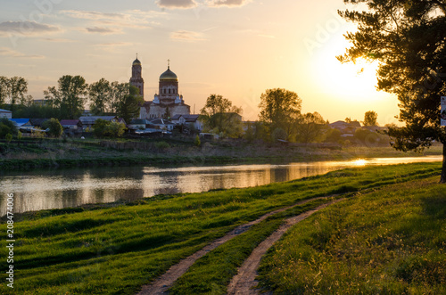 Russian village at sunset © евгений ставников