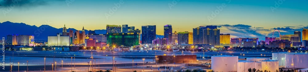 Skyline view at sunset of the famous Las Vegas Strip located in world class hotels and casinos, NV - obrazy, fototapety, plakaty 