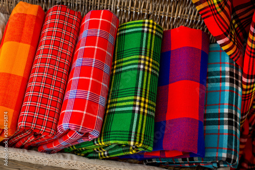 Colorful plaids of the Masai tribe. African blankets from Kenya and Tanzania. Blankets for the house. Shawls photo