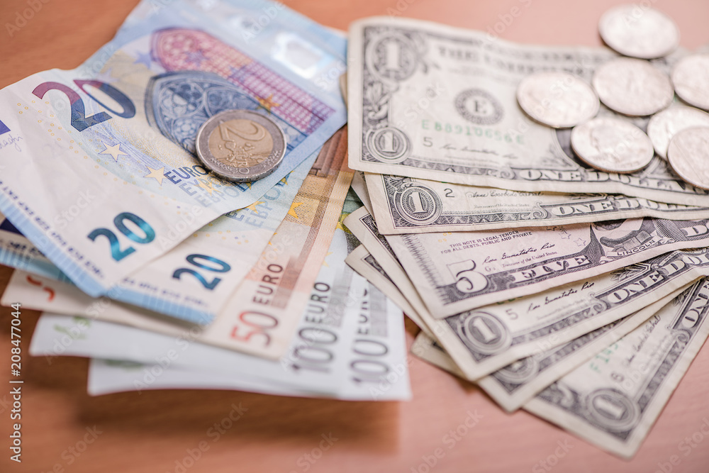 euro paper bank notes against american dollar currency euro paper bank notes against american dollar currency