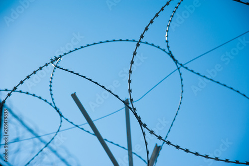 Barbed fence around prison walls