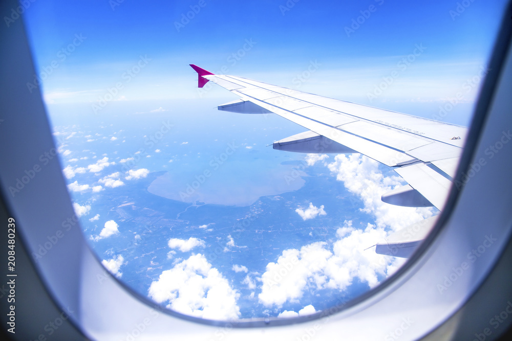 Aerial view from airplane window with sky clouds Aerial view from airplane window with sky clouds