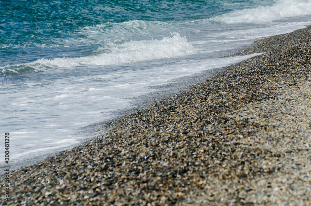pebble beach washed by sea waves, small and various stones forming the shore pebble beach washed by sea waves, small and various stones forming the shore