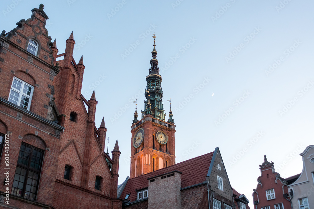 Photo of the old town of Gdansk architecture in sunset light. Aerial shot. Channel and buildings - top view Photo of the old town of Gdansk architecture in sunset light. Aerial shot. Channel and buildings - top view