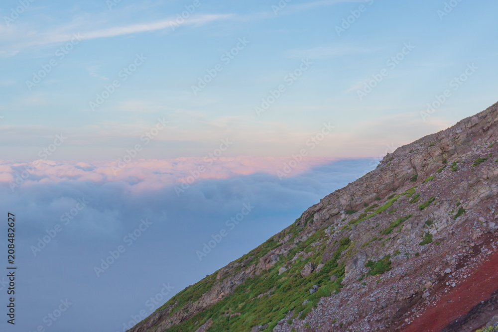 Shadow of Mt. fuji with cloudy sky view from top of Mt. fuji.