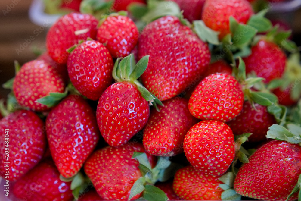 fresh red strawberry in the plastic box ready for sell in the fruit market. fresh red strawberry in the plastic box ready for sell in the fruit market.