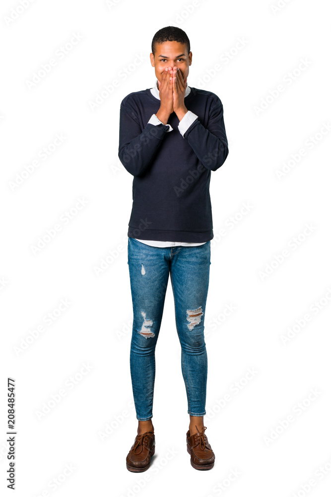 Young african american man smiling a lot while covering mouth on isolated white background Young african american man smiling a lot while covering mouth on isolated white background