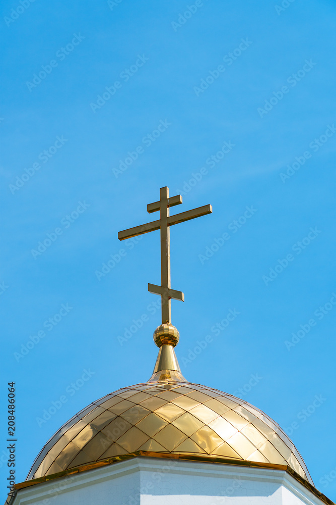 Orthodox cross on the dome of church