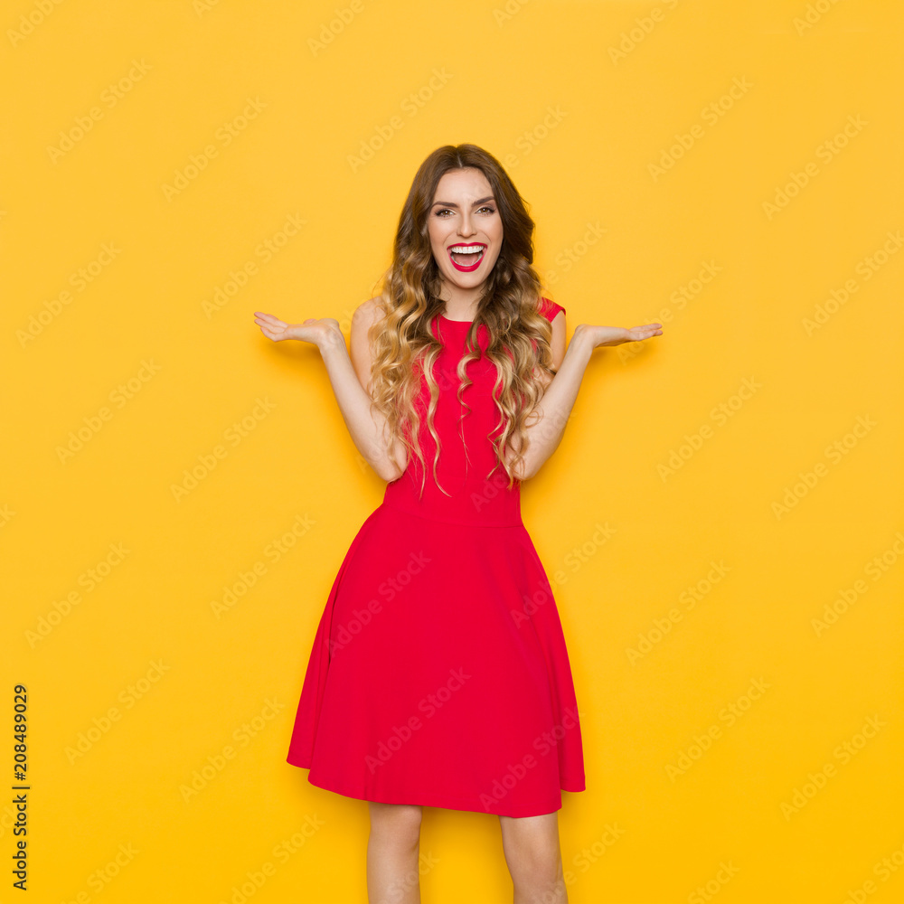 Laughing Beautiful Woman In Red Dress With Arms Outstretched Laughing Beautiful Woman In Red Dress With Arms Outstretched