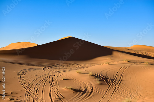 A large dune on our way in the Sahara desert. Photograph taken somewhere in the Sahara desert in Merzouga Morocco