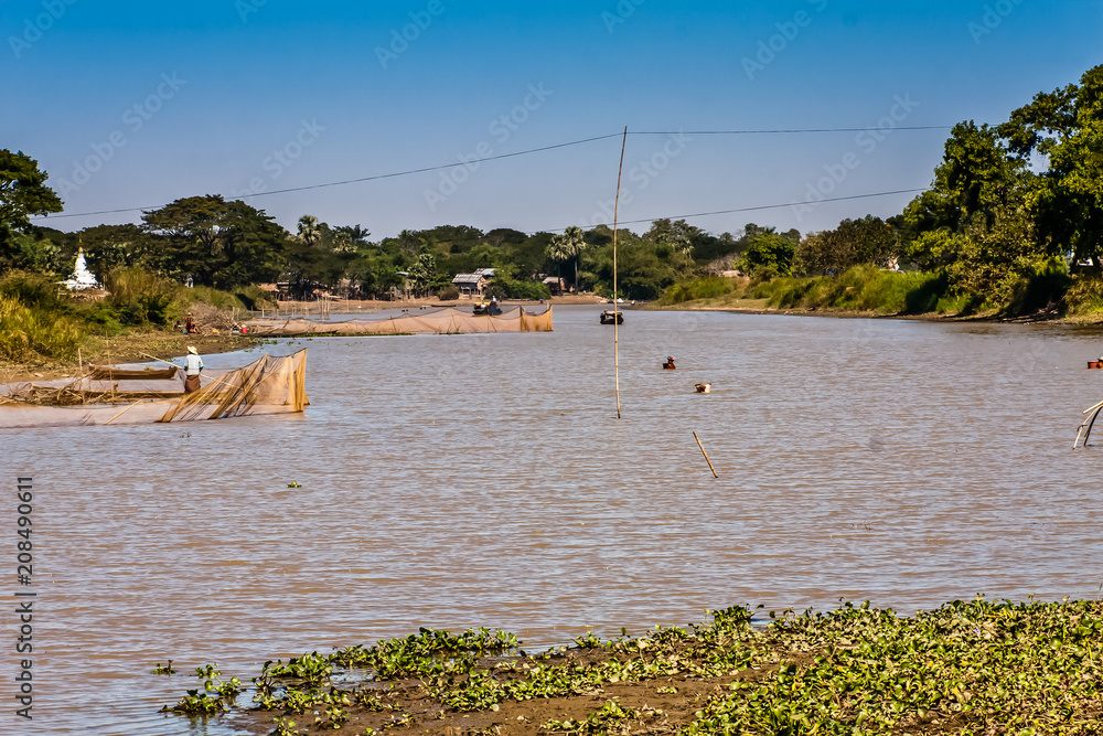 Fishermen in a freshwater pond, Bago Region, Myanmar Fishermen in a freshwater pond, Bago Region, Myanmar