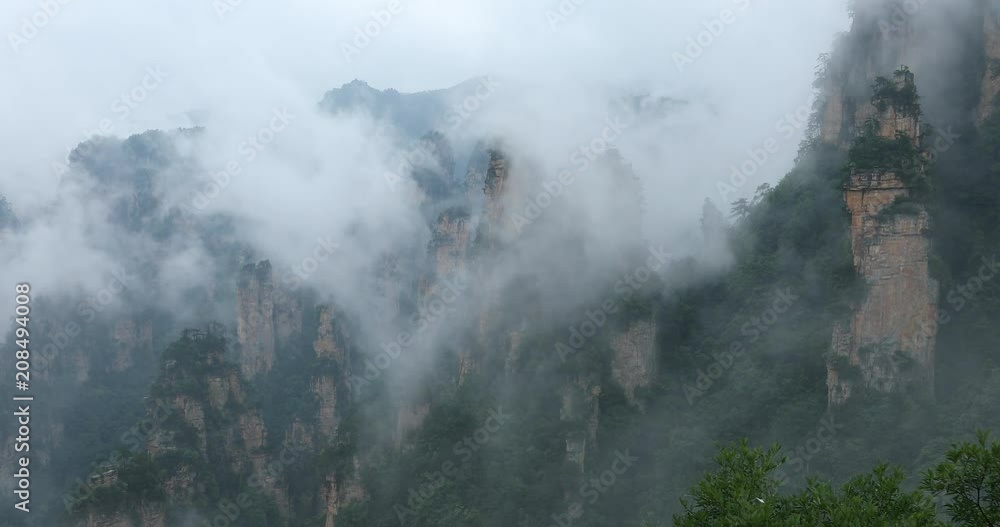 Zhangjiajie Forest Park. Gigantic pillar mountains rising from the canyon. Hunan province, China. Zhangjiajie Forest Park. Gigantic pillar mountains rising from the canyon. Hunan province, China.