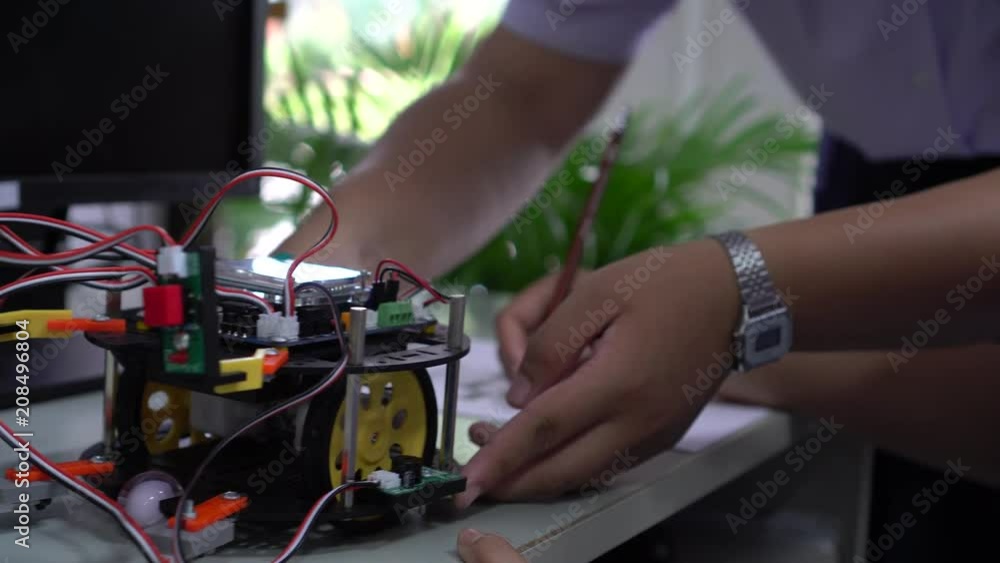 Learning STEM Education robotics project concept: Asian Student group creating and studying for innovation robot model ipst that Study generation for DIY electronic Kit in 21st education classroom Learning STEM Education robotics project concept: Asian Student group creating and studying for innovation robot model ipst that Study generation for DIY electronic Kit in 21st education classroom