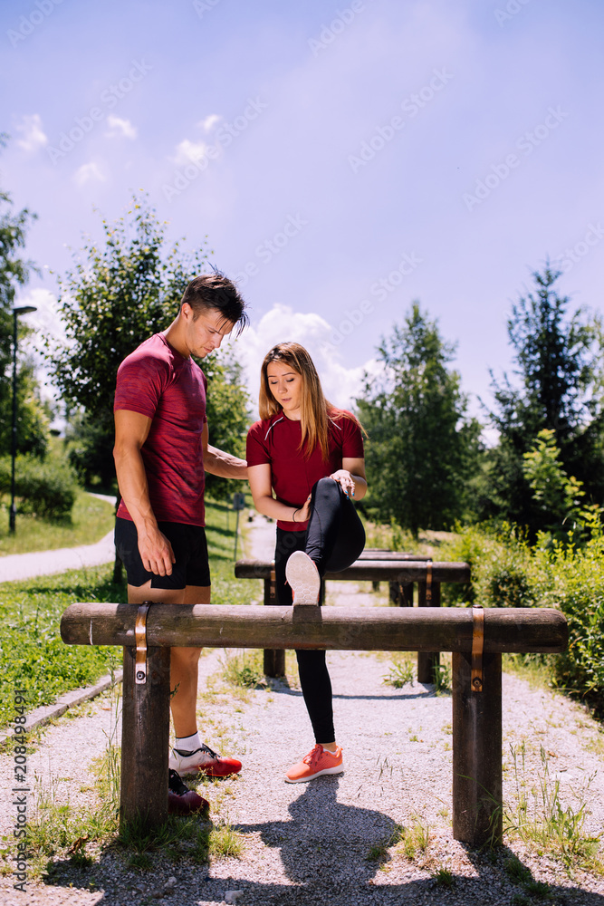 Young fitness couple outdoor exercise