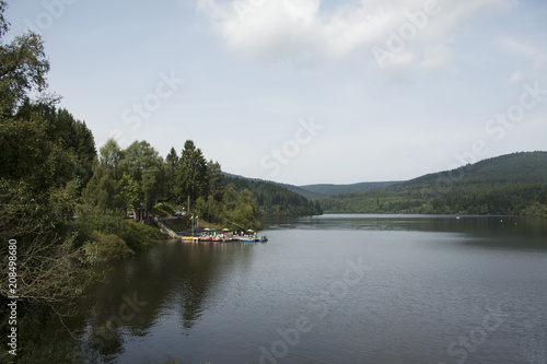 German and foreigner travelers people playing and paddle boat in Schwarzenbachtalsperre Lake at Germany © tuayai