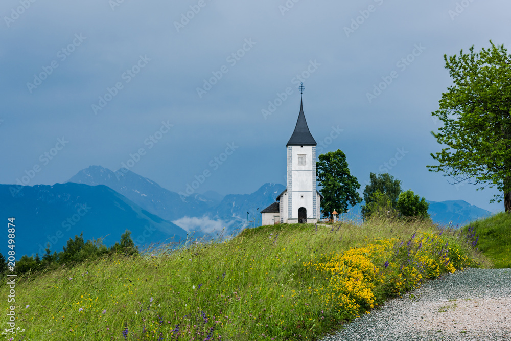 Church of St. Primus and Felician, Jamnik Slovenia at stormy weather Church of St. Primus and Felician, Jamnik Slovenia at stormy weather