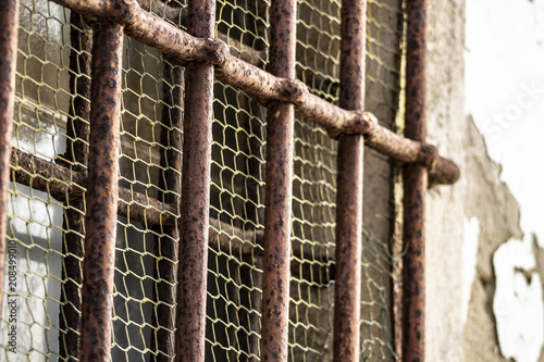 Rusty bars of a jail © LoveComunication