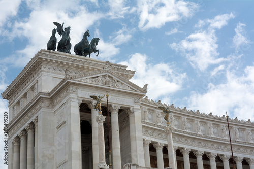 Horizontal View of the Altar of the Fatherland on Blue Partially Cloudy Sky Background