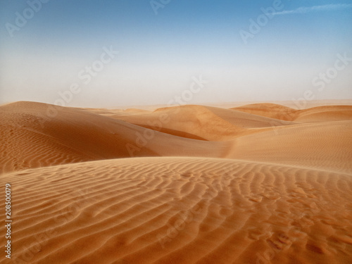 The dunes of the Wahiba Sands desert in Oman at sunset during a typical summer sand storm - 4