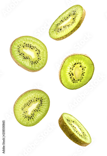 sliced flying kiwi isolated on white background with clipping path. cut kiwi fruit in pieces isolated on white background. Levity fruit floating in the air.