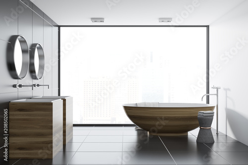 Black tile bathroom interior  wooden tub and sink