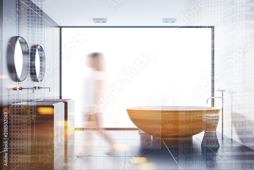 Black tile bathroom  wooden tub and sink toned