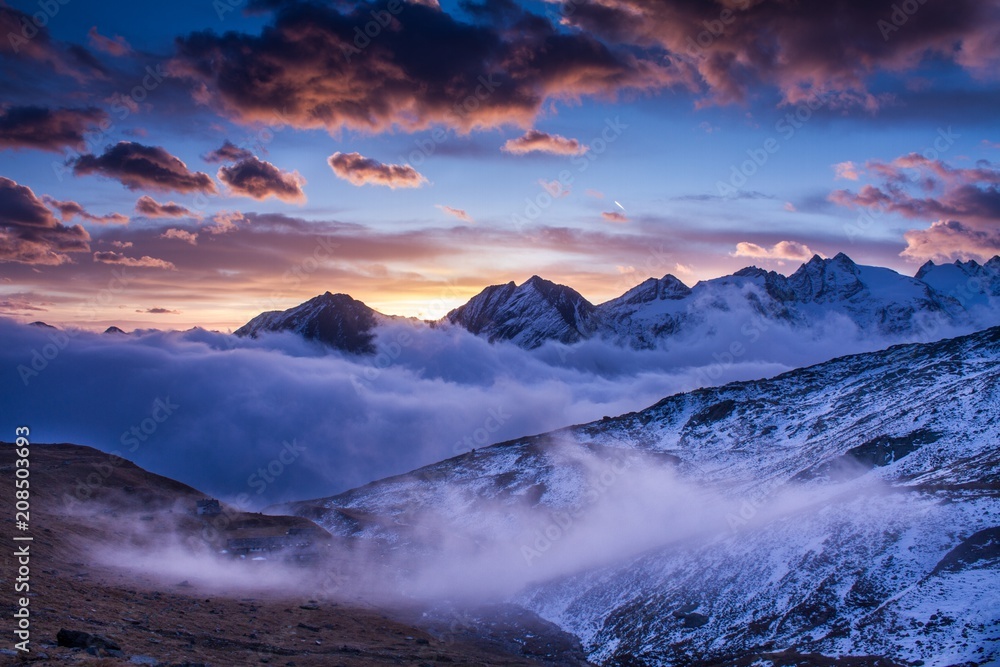 Sunrise in National Park Gran Paradiso. Beautiful sunrise scenery. Mist during sunrise in Alps (Italy), beautiful mountains view, magical sunrise in mountains, autumn, colourful landscape scenery