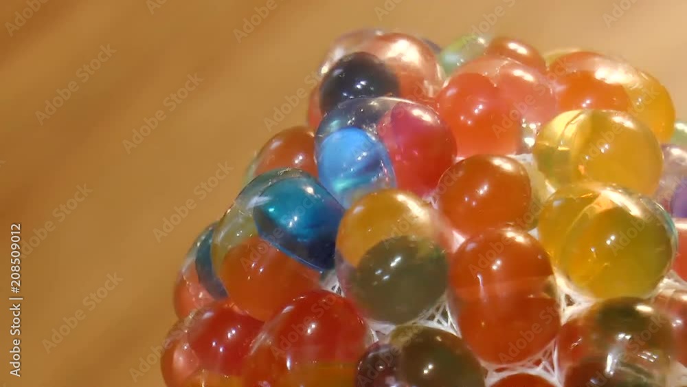 Video shows Multicolored bubbles with liquid inside Video shows Multicolored bubbles with liquid inside