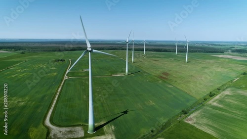 This is an aerial drone camera shot of windmills park. photo