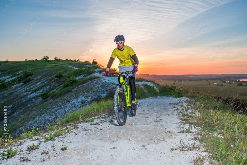 Fototapeta premium Cyclist Riding the Bike on the Beautiful Mountain Trail. 