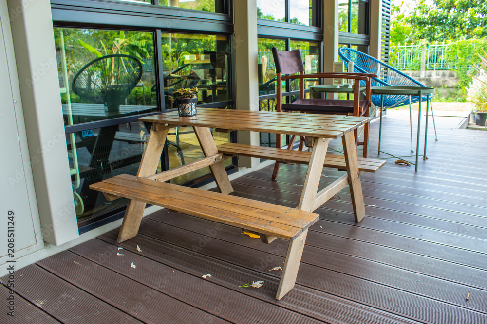 Wooden table and chairs seating In the garden. Wooden table and chairs seating In the garden.